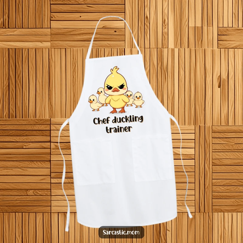 Funny determined mother duck character leading a chaotic line of ducklings while cooking in this practical and humorous apron.