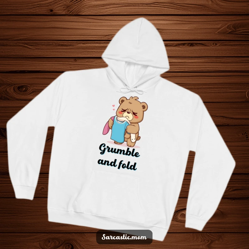 Funny Grumpy Bear Mom Hoodie, a mama bear sighing under the weight of laundry, offering cozy comfort and humor.