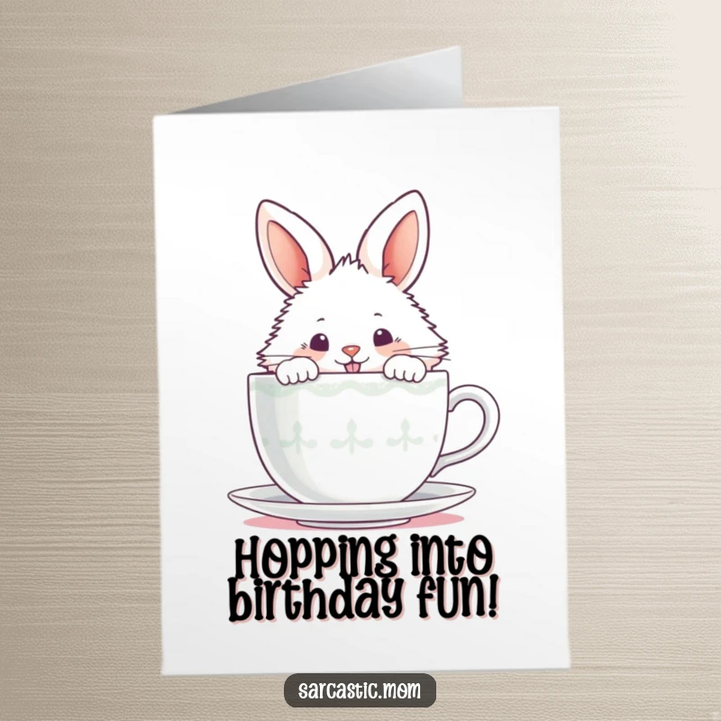 Funny Free Printable Birthday Card: Fluffy bunny peeking over steaming teacup, mischievous grin, birthday surprise, DIY gift.
