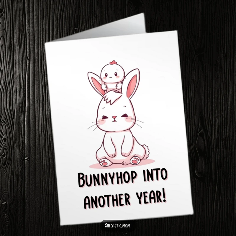 Funny free printable birthday card featuring a stressed bunny mom balancing a baby on her head with a wobbly expression.