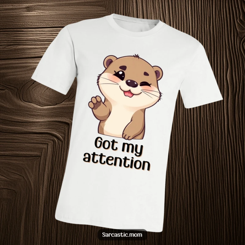 Funny otter t-shirt, smiling with a quizzical eyebrow raised and paw up, inviting a laugh. A cool funny gift.