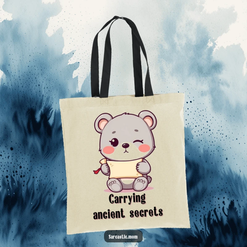 Funny cute bear cub with a knowing wink holding a tiny rolled-up scroll on a durable tote bag.